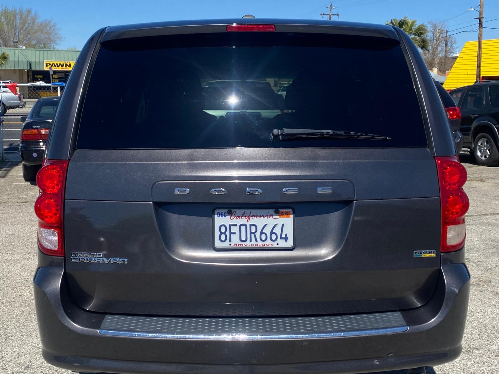 2016 /BLK Dodge Grand Caravan (2C4RDGBG8GR) with an V6, FLEX FUEL, 3.6 LITER engine, AUTOMATIC 6-SPD transmission, located at 44356 Date Ave., Lancaster, CA, 93534, (661) 945-6555, 34.688919, -118.139374 - Photo #1